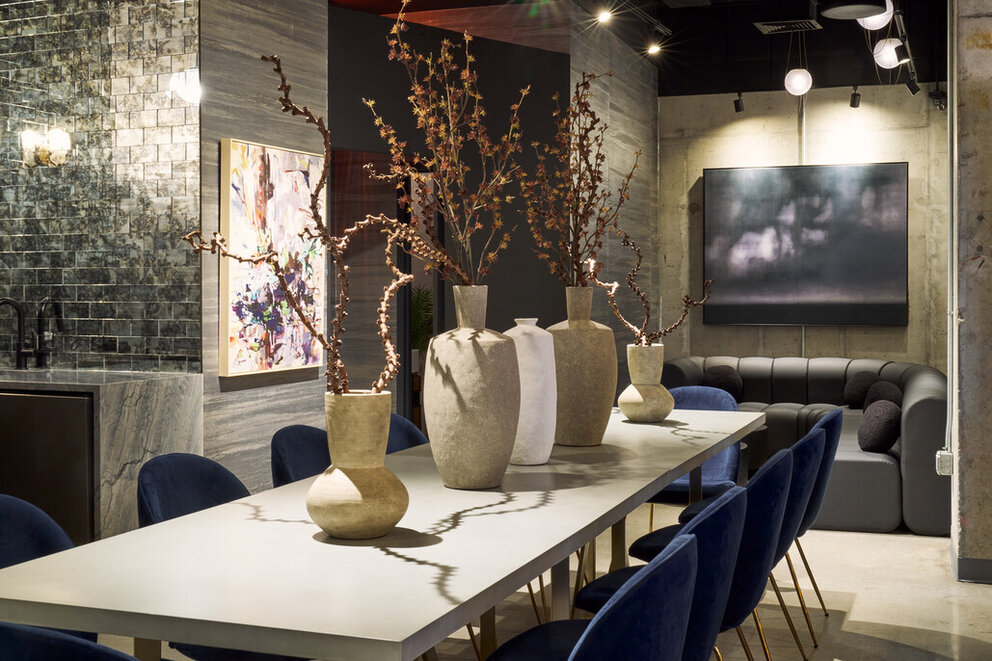 a table with vases and chairs