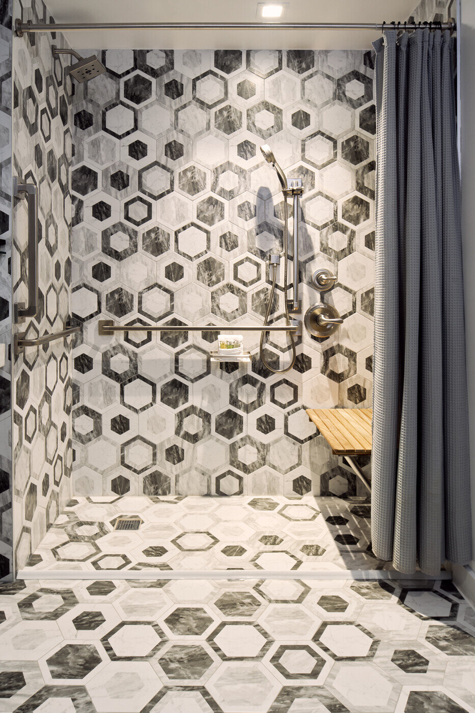 a shower with a shower head and shower head