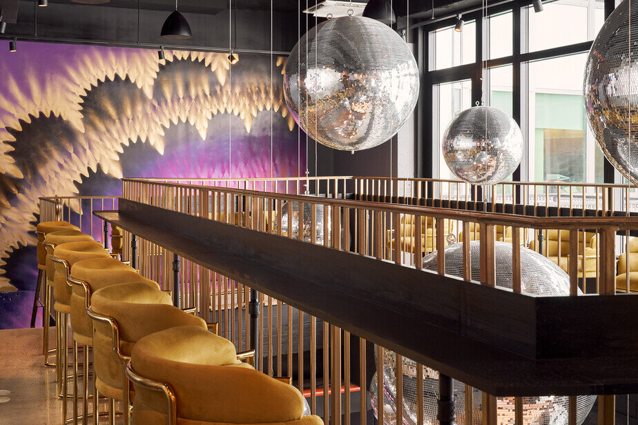 a room with chairs and disco balls