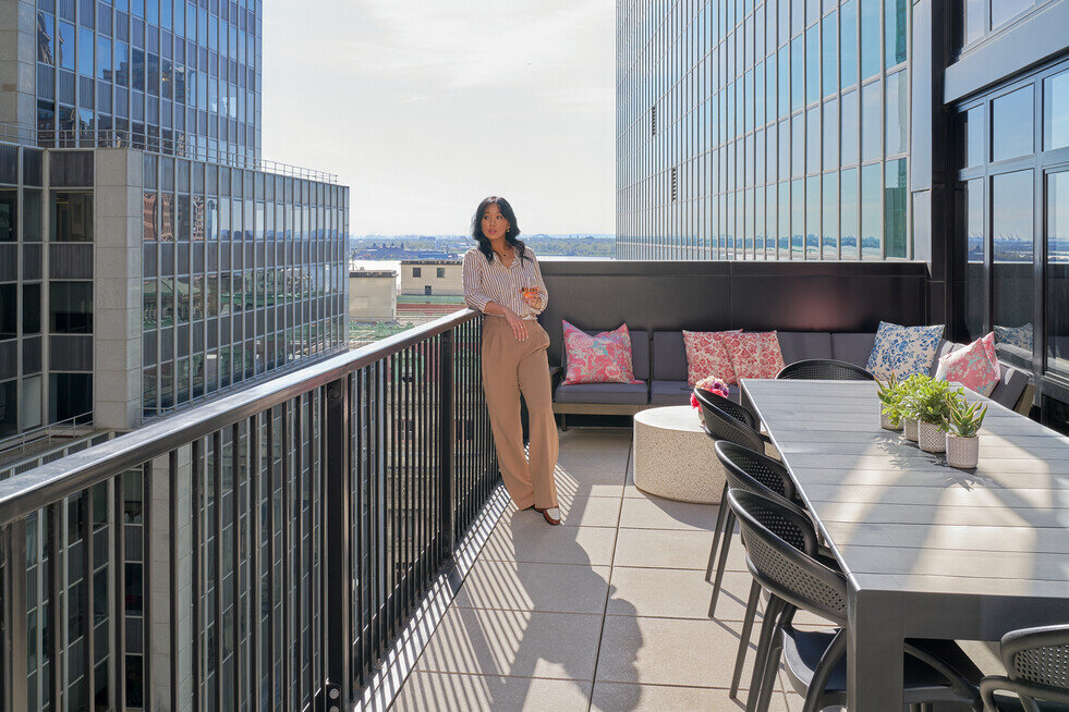 a woman standing on a balcony